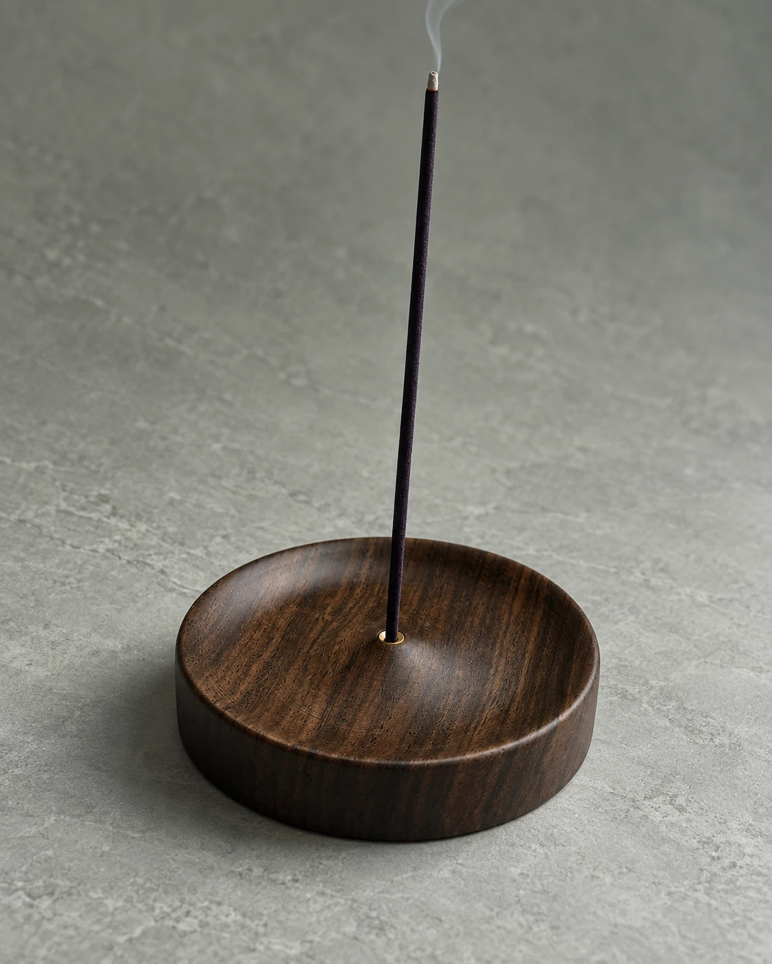 Finished product image of the dark wooden holder and brass incense opening